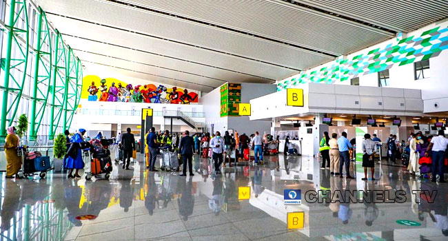 Nigerians Foreigners Storm Abuja Airport For International Travels LHPEYd